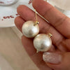 Large pearl stud earrings