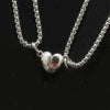 Pair of silver heart magnetic necklaces