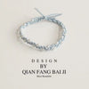Light blue braided pearl hair tie