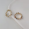 White shaped zircon ring