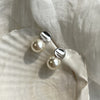 Curved pearl stud earrings