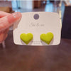 Green heart stud earrings