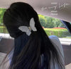 Thick white butterfly clip
