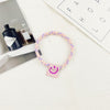 Smiley cloth label (pink)