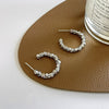 A pair of s925 silver needle silver stud earrings