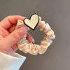 Creamy white heart hair ties