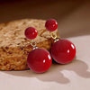 C02 round beads [acrylic red] gold stud earrings