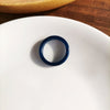 A dark blue ring