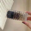 Box of 9 dark hair rings