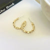 A pair of s925 silver needle gold stud earrings