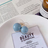 2 blue beads