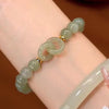 M65 [interlocking bracelet green beads] 1