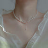 Big and small butterfly faux pearl necklace