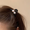Small yellow and white pearl clip