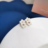 A pair of s925 silver needle white stud earrings