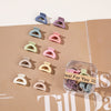 10 square boxes of semi-circular grippers