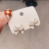White bow stud earrings