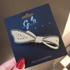 Asymmetric bow spring clips