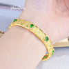 Textured carved gold and green diamond bracelet [opening]