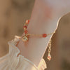Red bead bell bracelet