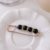 5# large black bead + drill