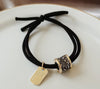 Black hair tie