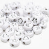 Silver lettering on white background