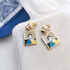 A pair of geometric ear clips