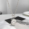 Rotating smiley necklace